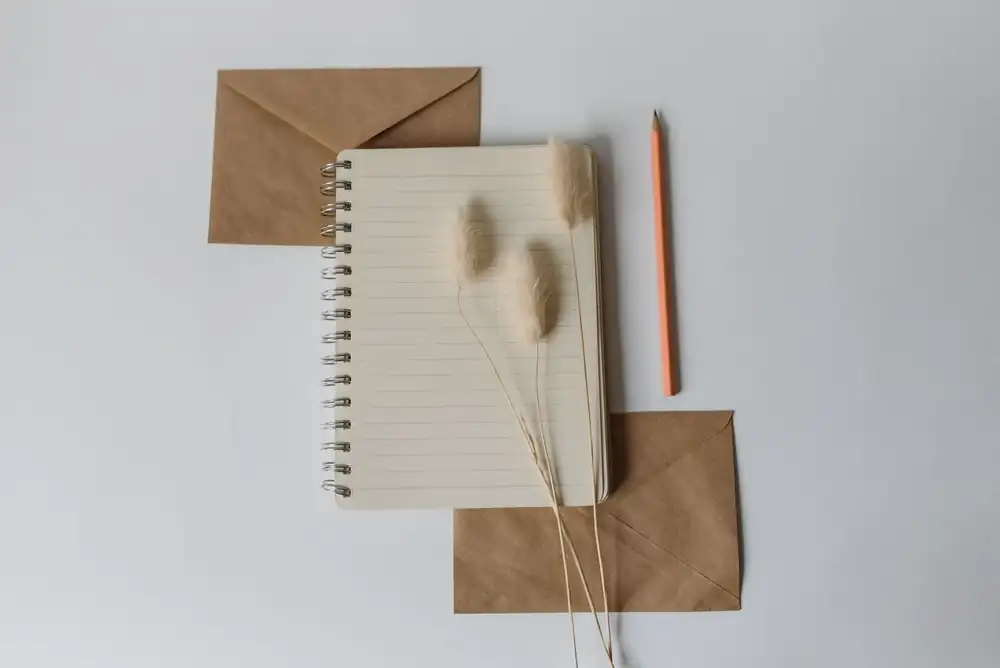 Notebook and pencil ready for a written brief
