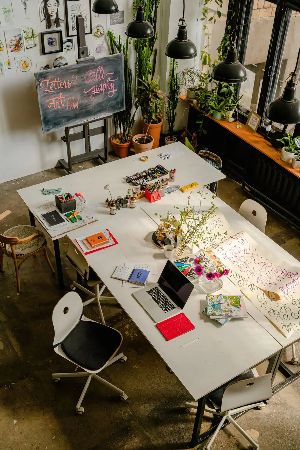 Artist workspace with tools and materials arranged on a table